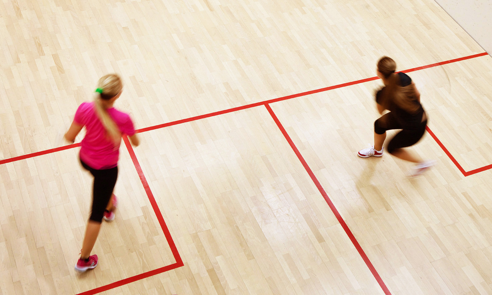 Biddenden Squash Club lady members enjoying a friendly game of squash.