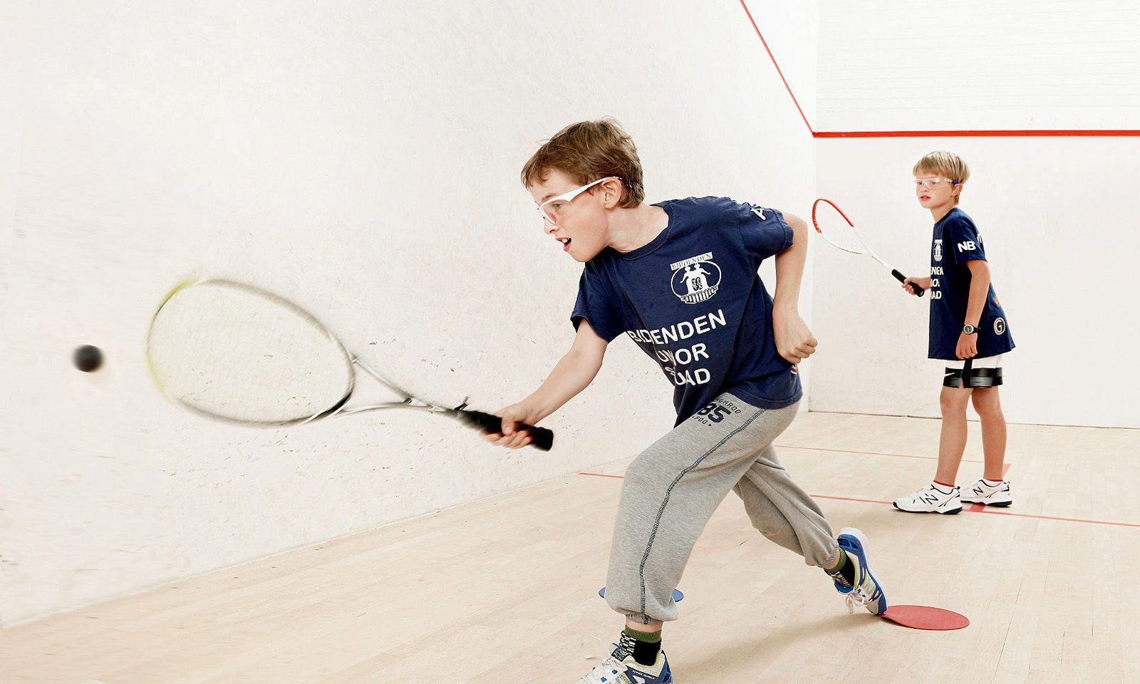 Two of Biddenden Squash Clubs under 9 players in training.